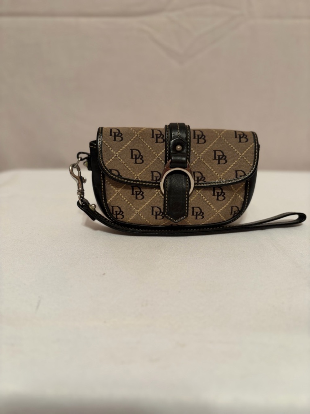 Dooney & Bourke Tan Monogram Wristlet with Black Trim